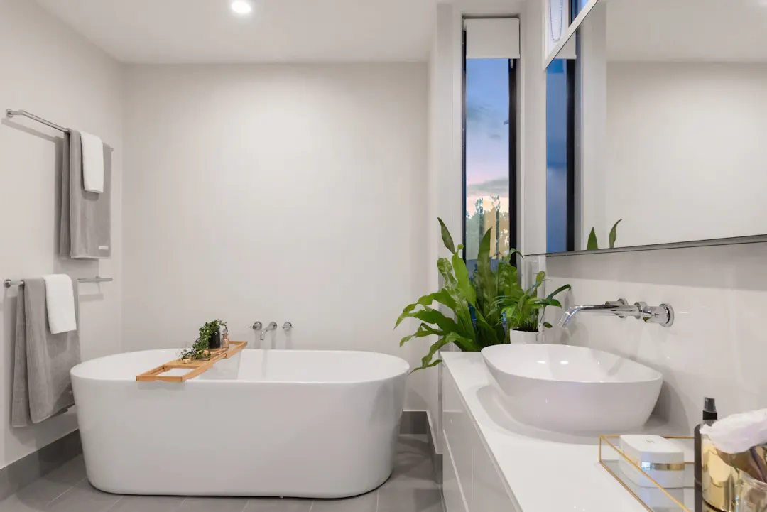 Bright bathroom with a freestanding tub and a vessel-sink vanity