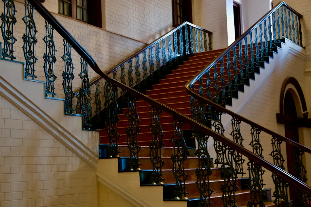 Grand staircase with ornate wrought-iron railings