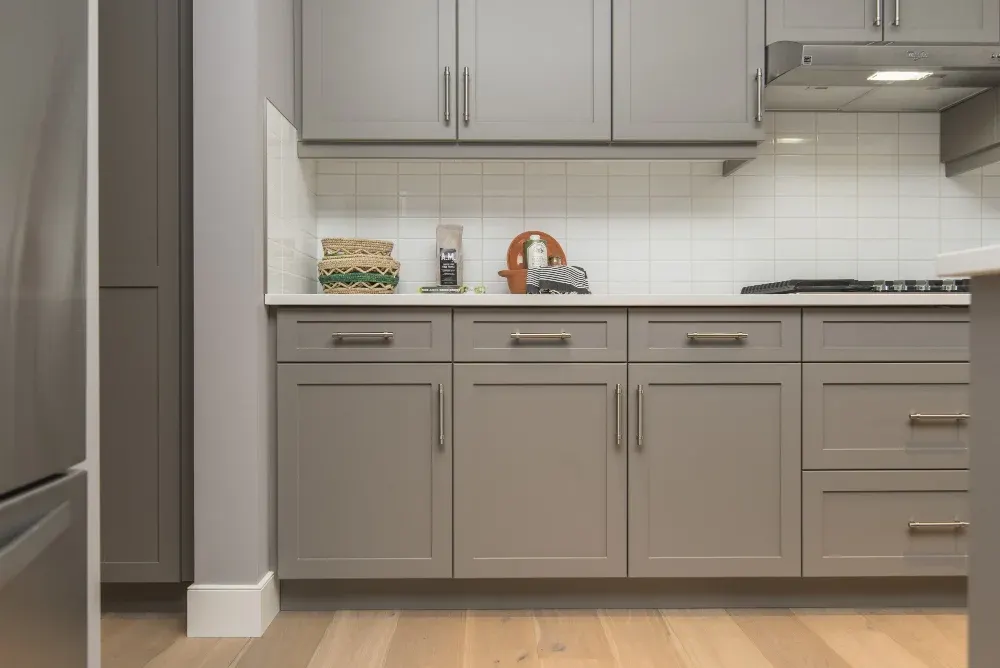 Gray shaker kitchen cabinets with stainless appliances