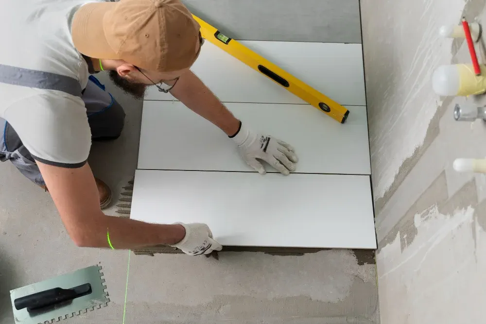 Installer leveling large-format floor tile