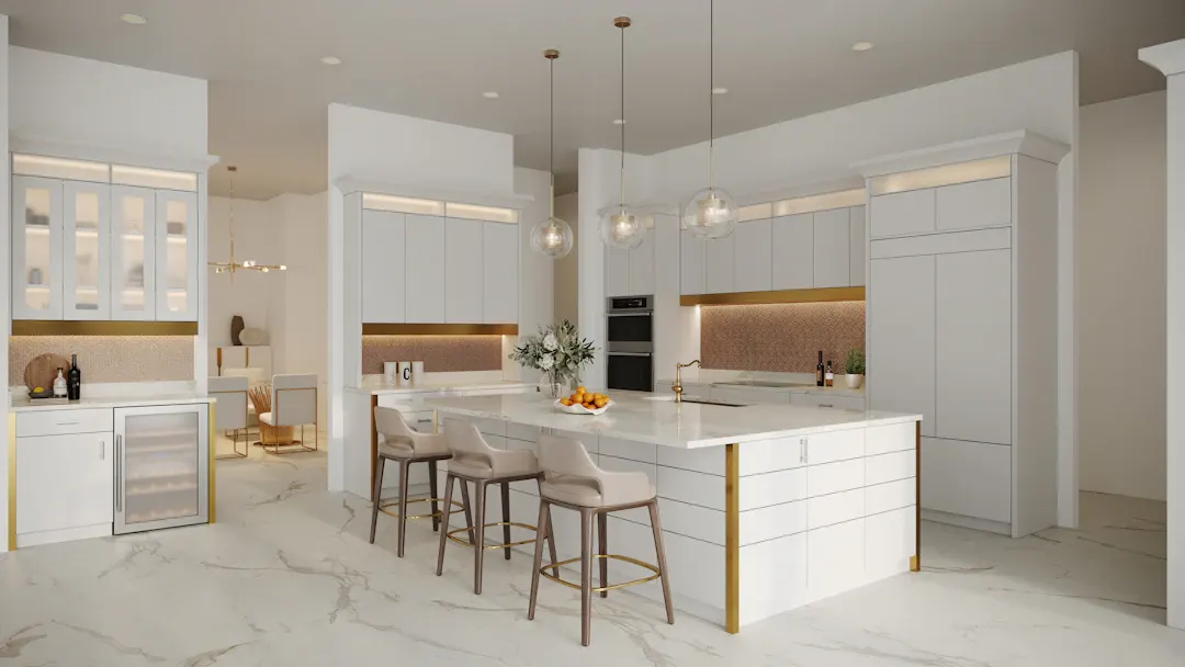 White kitchen with a gold-trimmed island and bar stools