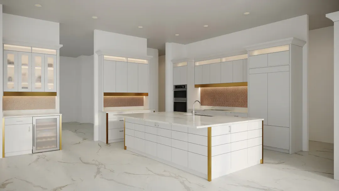 White kitchen with a large island and gold accent trim