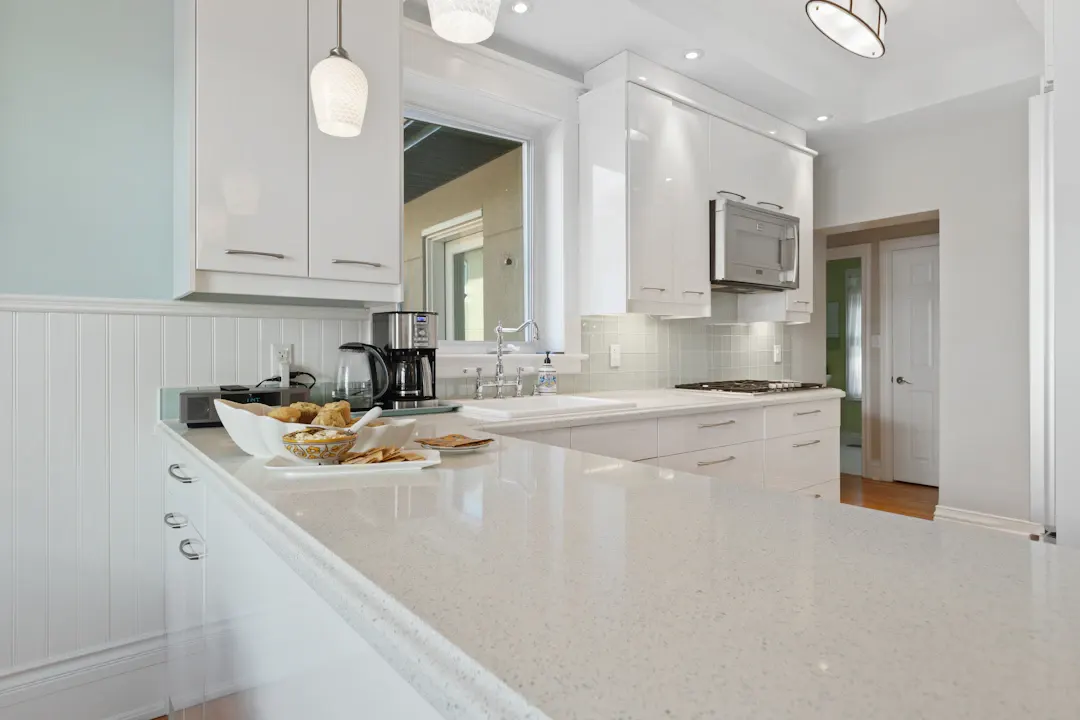 Kitchen with seamless white solid-surface countertops