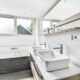 Custom bathroom vanity in a small modern bathroom maximizing storage and style
